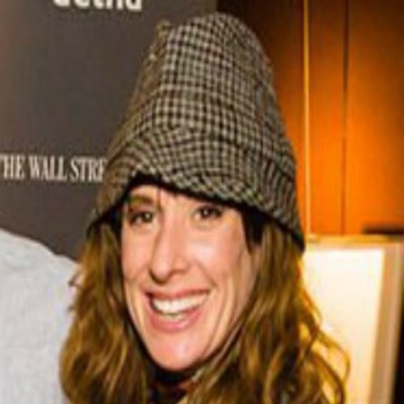 Manasiadis has brown hair and she was wearing a hat.